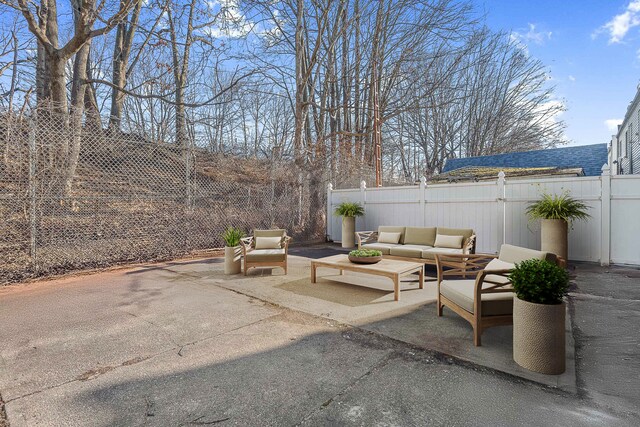 view of patio / terrace with a fenced backyard and an outdoor living space
