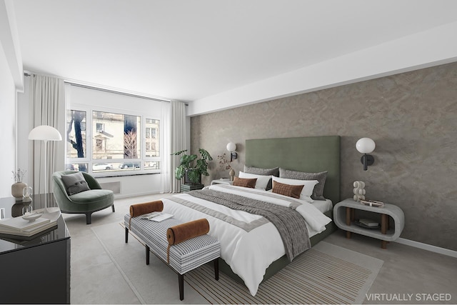 bedroom with wallpapered walls, light carpet, and baseboards