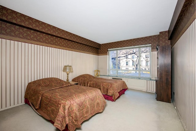 bedroom with wallpapered walls