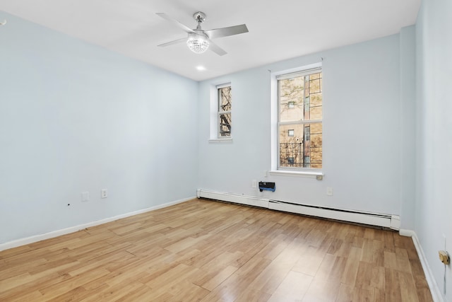 249 Hull St Unit B, New York City, NY 11233 - spare room with a baseboard radiator, light wood finished floors, and ceiling fan
