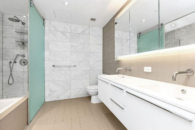 full bath featuring tile walls, tiled shower, toilet, a bath, and double vanity