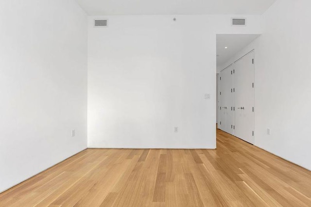 spare room with light hardwood / wood-style flooring