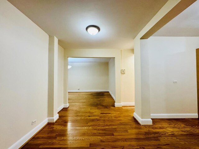 hallway featuring dark hardwood / wood-style floors