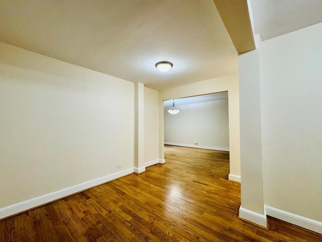 spare room featuring hardwood / wood-style floors