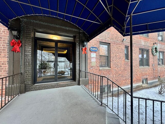 view of snow covered property entrance