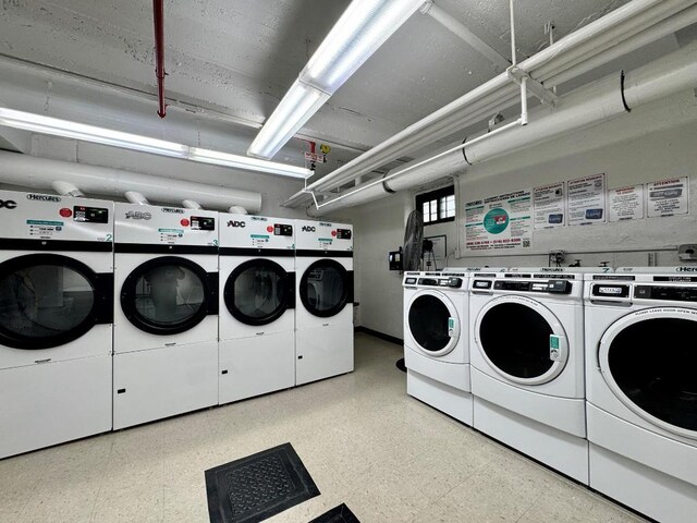 clothes washing area with independent washer and dryer