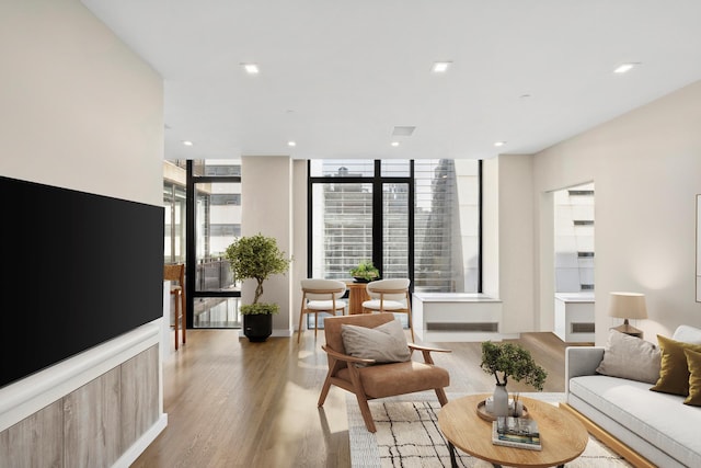 living room featuring recessed lighting and light wood finished floors