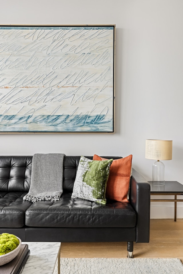 living room featuring wood finished floors and baseboards