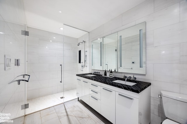 230 E 20th St Unit 23, New York City, NY 10003 - full bath featuring tile walls, double vanity, and a shower stall