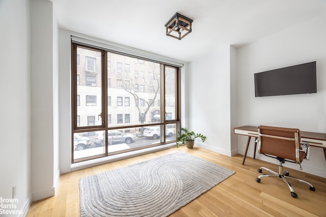 230 E 20th St Unit 23, New York City, NY 10003 - home office featuring light wood-type flooring and expansive windows