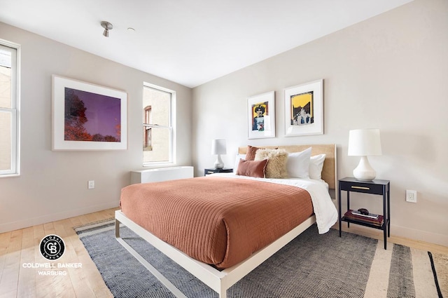 bedroom with hardwood / wood-style floors