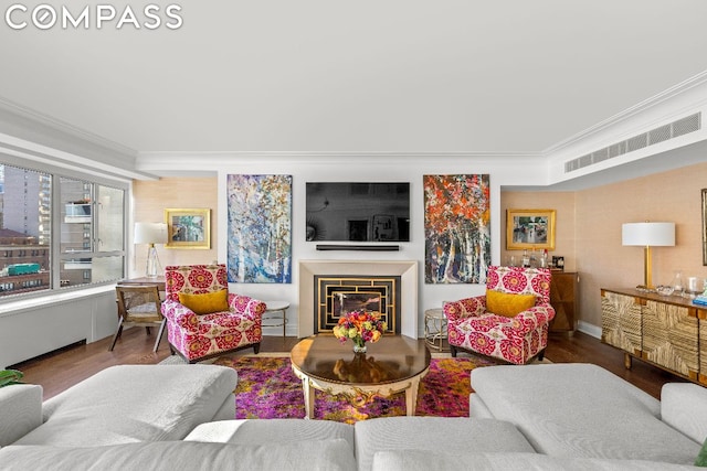 living room featuring hardwood / wood-style floors and ornamental molding