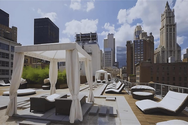 view of patio with a view of city and a gazebo