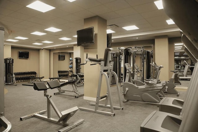 exercise room with a paneled ceiling