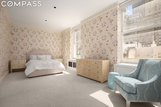 bedroom featuring crown molding and carpet