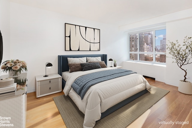 bedroom featuring light wood-type flooring