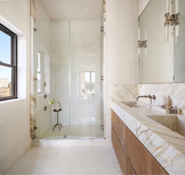 bathroom with vanity and a shower stall