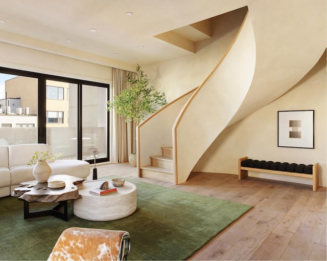 living room featuring stairs and hardwood / wood-style floors