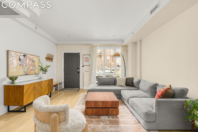 living room with light hardwood / wood-style flooring