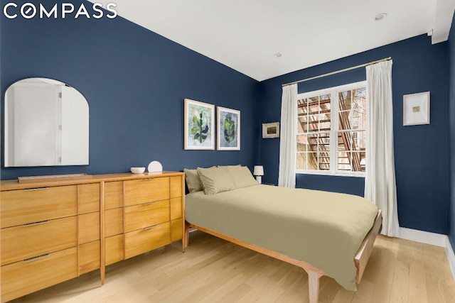 bedroom with light hardwood / wood-style floors