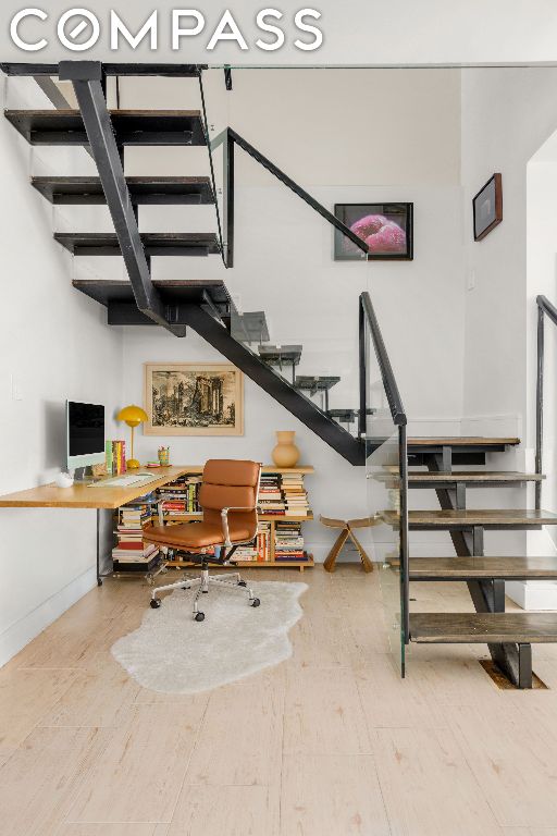 stairway featuring wood-type flooring