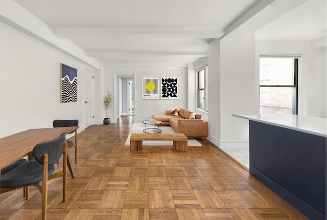 living room featuring light parquet floors and beam ceiling