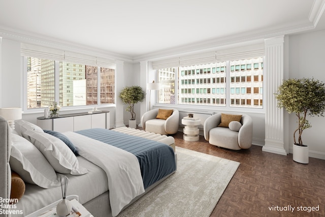 bedroom featuring baseboards, multiple windows, and ornamental molding