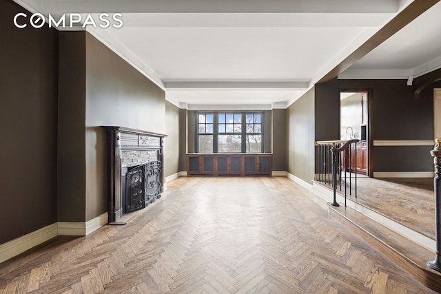 unfurnished living room featuring parquet floors and beamed ceiling