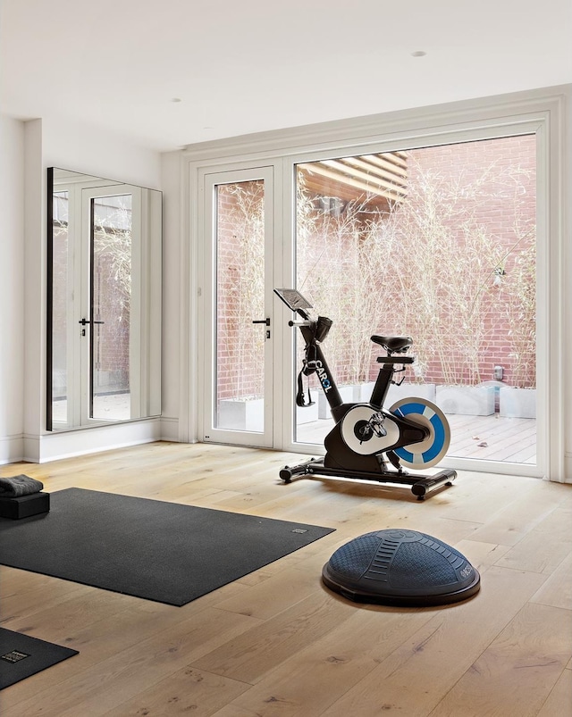 workout area with wood-type flooring