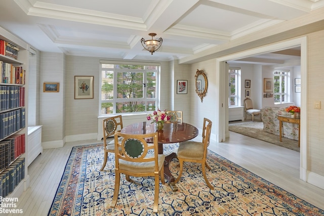 2 Beekman Pl Unit 4Abg, New York City, NY 10022 - dining area featuring wood finished floors, beam ceiling, a chandelier, coffered ceiling, and ornamental molding