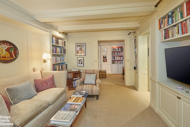 2 Beekman Pl Unit 4Abg, New York City, NY 10022 - living area with crown molding, beam ceiling, a decorative wall, light colored carpet, and built in features