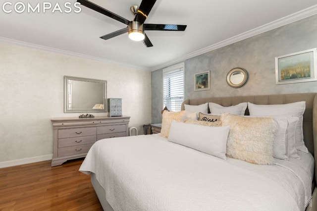 bedroom with ceiling fan, hardwood / wood-style floors, and crown molding