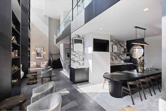 interior space with recessed lighting, stairway, and marble finish floor