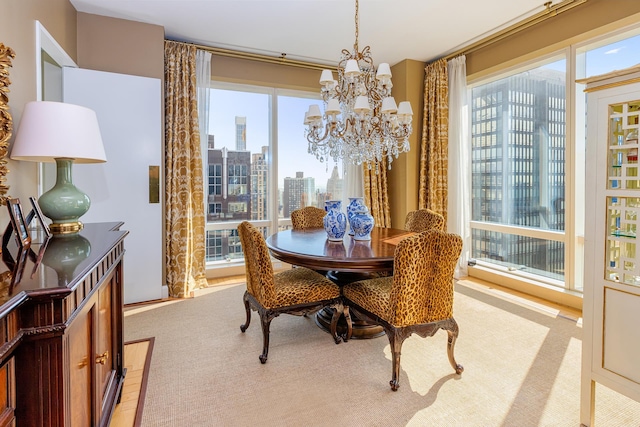 dining space featuring a chandelier and a city view