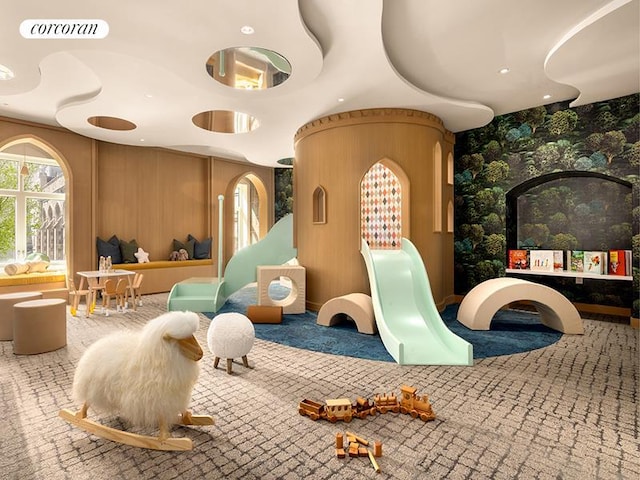 recreation room with visible vents and carpet floors