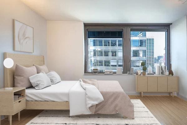 bedroom featuring light wood-type flooring