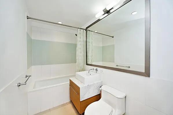 full bathroom featuring vanity, toilet, and separate shower and tub