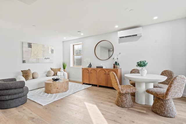 interior space featuring a wall unit AC and light wood-type flooring