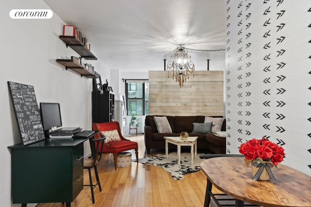 living room featuring wood-type flooring and a chandelier