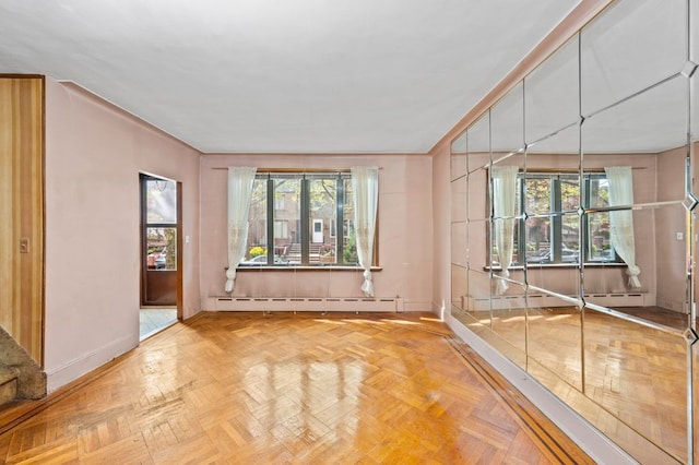 283 Bay 14th St, New York City, NY 11214 - empty room with a baseboard radiator, baseboards, and healthy amount of natural light