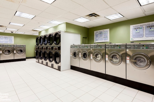 shared laundry area featuring washing machine and clothes dryer