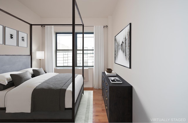 bedroom featuring light wood-style floors