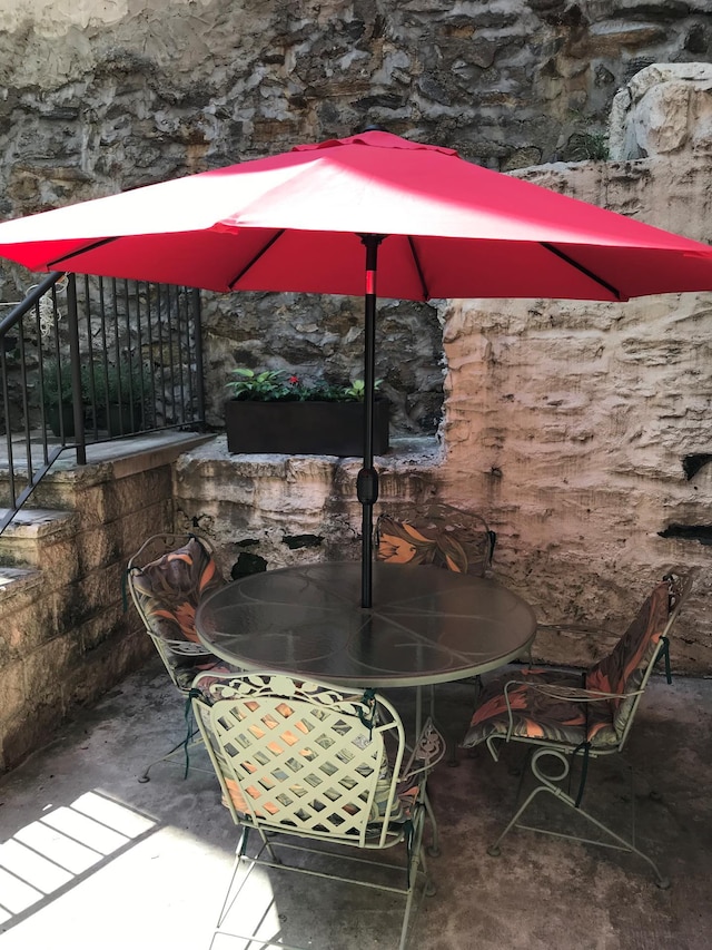 view of patio featuring outdoor dining area