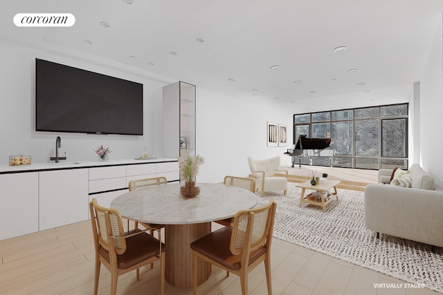 dining room with light wood-type flooring, visible vents, and recessed lighting