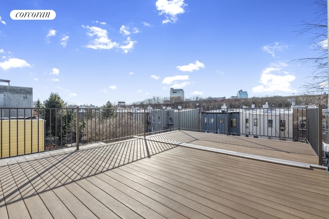 wooden deck with a view of city