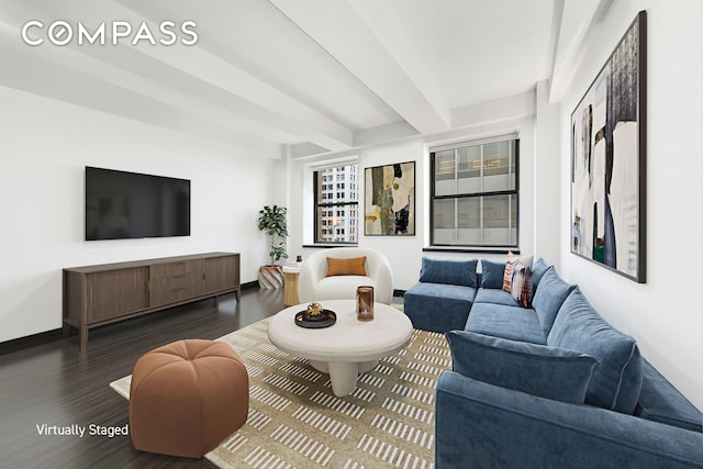 living area with beamed ceiling, wood finished floors, and baseboards