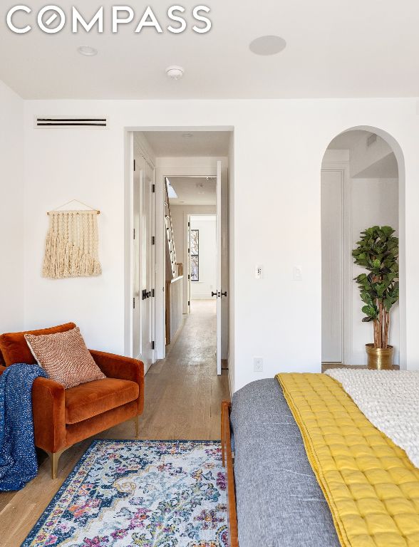 bedroom with wood-type flooring