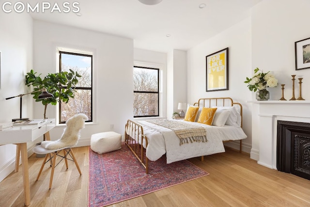 bedroom with light hardwood / wood-style floors