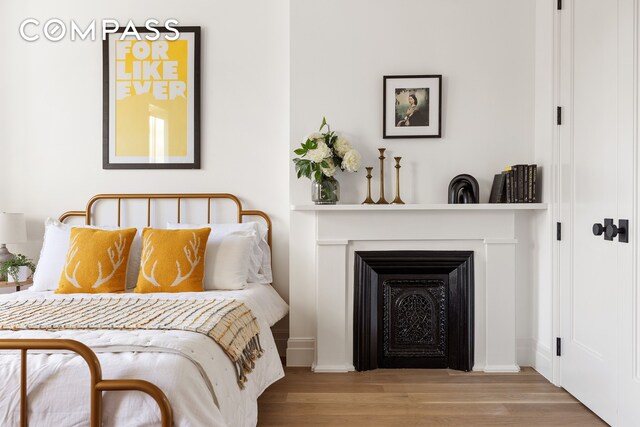 bedroom with light hardwood / wood-style flooring