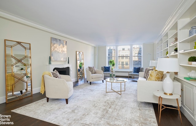 living room with dark hardwood / wood-style floors and crown molding